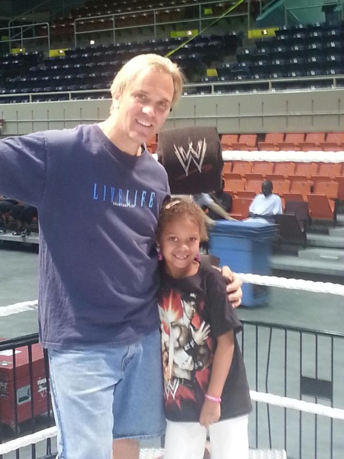Charles Robinson with Kip's daughter inside a WWE ring