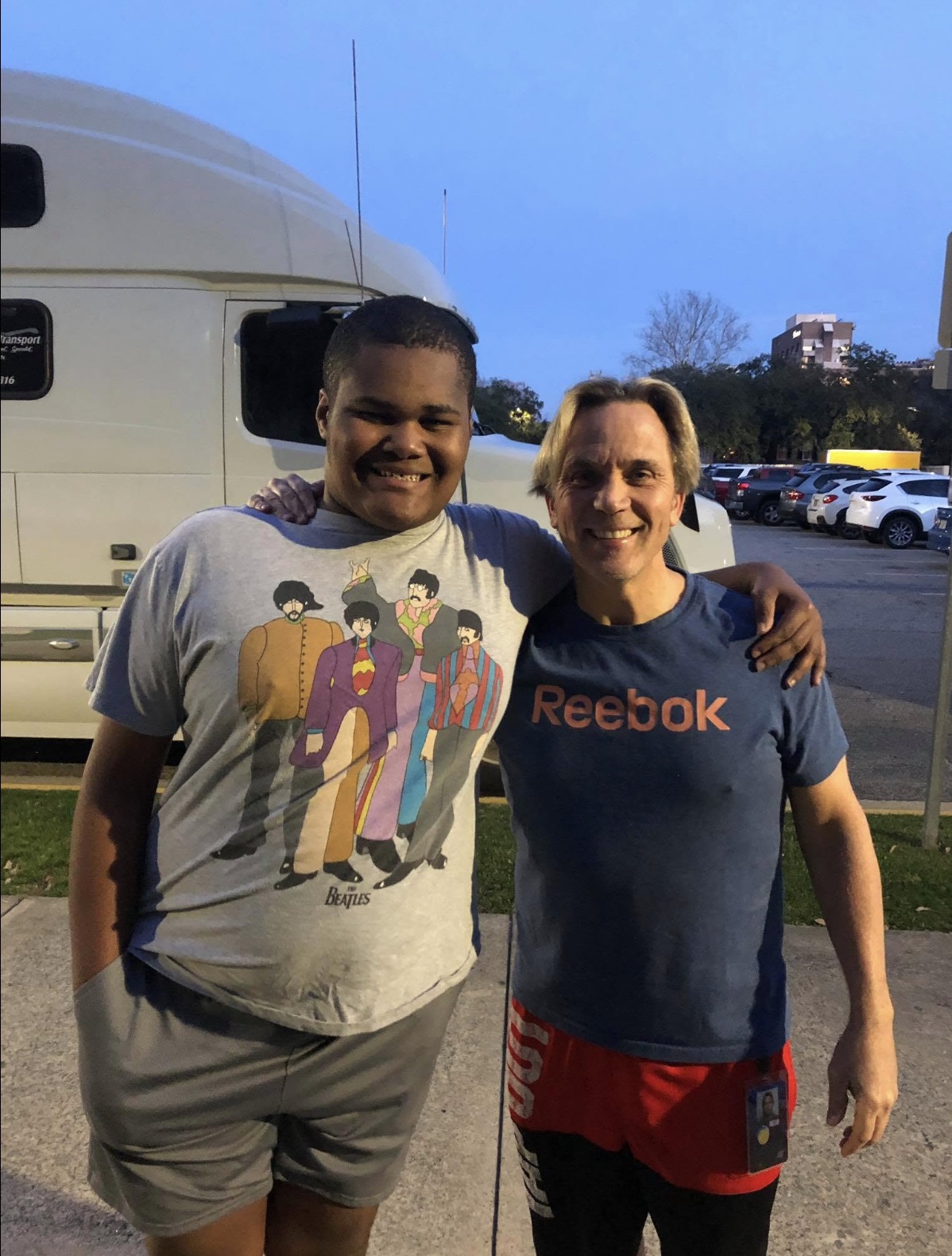 Charles Robinson with Kip Lee's son outside the arena by the WWE truck